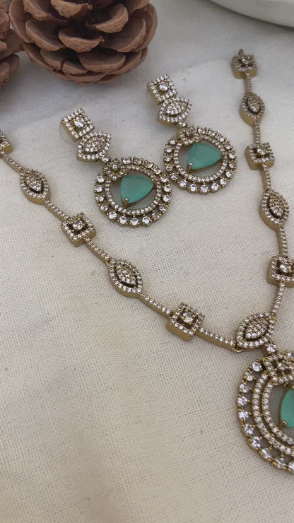 Polki necklace set with sea green stones